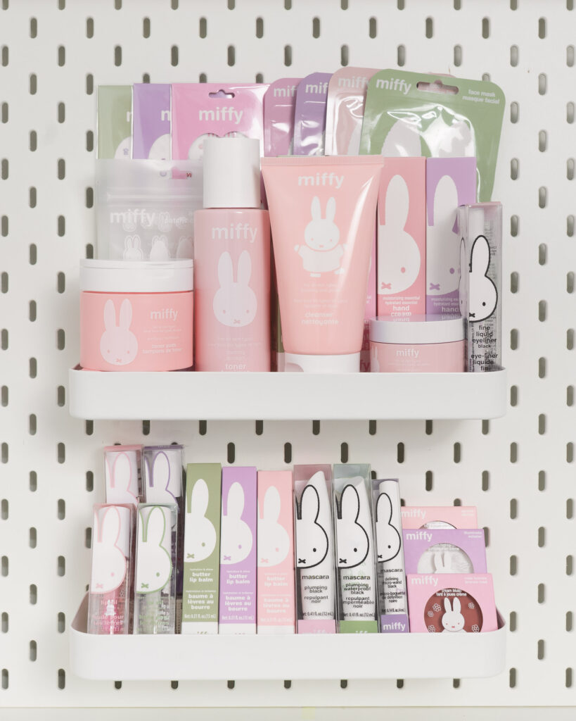 Display shelf featuring pastel pink and lavender Miffy skincare and cosmetic products.